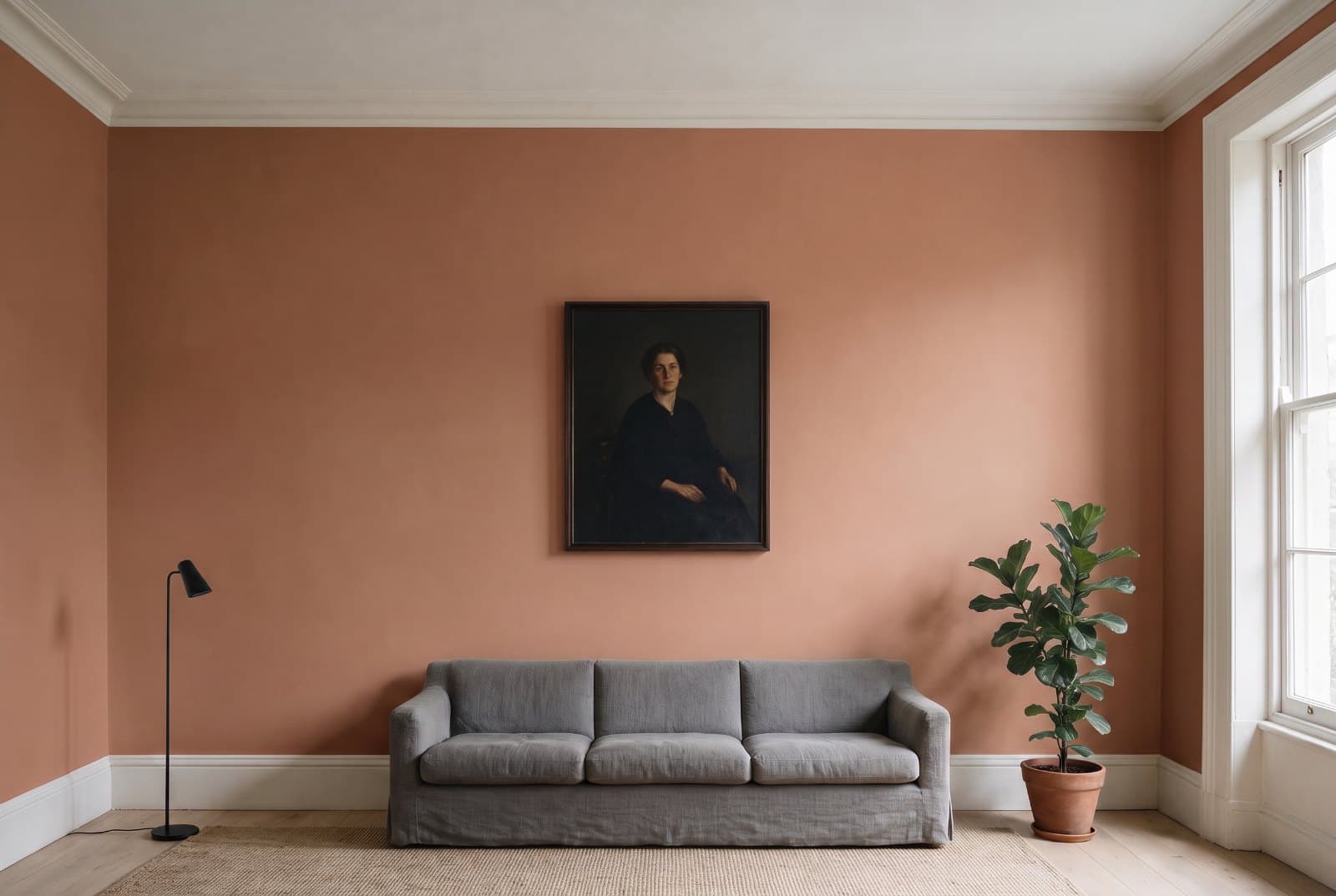 The same living room with the walls repainted in Sherwin-Williams Cavern Clay