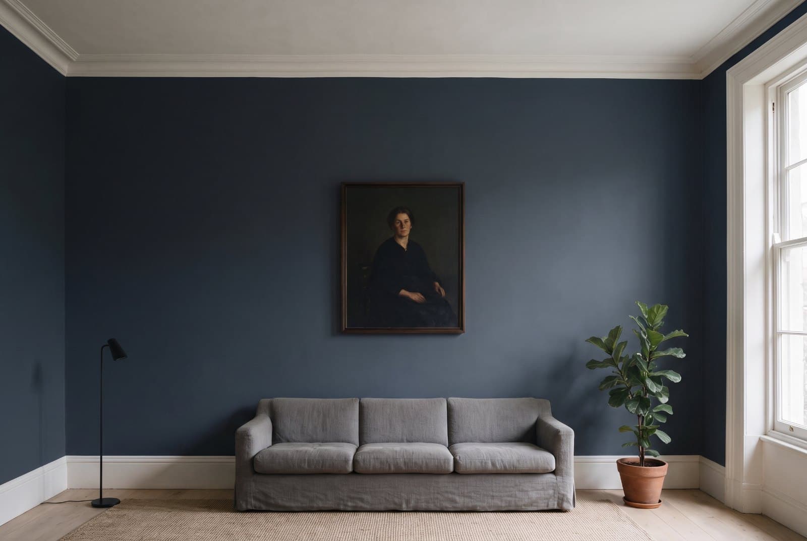 The same living room with the walls repainted in Sherwin-Williams Naval