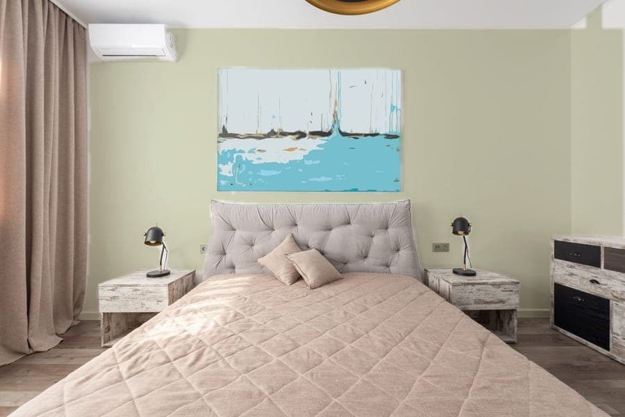 Bedroom wall in SW 6177 Softened Green, RoomCalm visualizer preview (on-screen approximation)